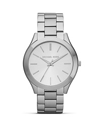 Get a fresh face with this silver tone watch from MICHAEL Michael Kors. It's three-hand movement is ever-practical while it's superfine dial and gold indexes lend this piece a distinctive look. Get a fresh face with this silver tone watch from MICHAEL Michael Kors. It's three-hand movement is ever-practical while it's superfine dial and gold indexes lend this piece a distinctive look.