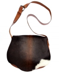 Give your look some giddyup with this southwestern-inspired saddle bag from Patricia Nash. Supple leather is accented with soft haircalf and antiqued brass hardware, for a look that's positively prairie-chic. Give your look some giddyup with this southwestern-inspired saddle bag from Patricia Nash. Supple leather is accented with soft haircalf and antiqued brass hardware, for a look that's positively prairie-chic.