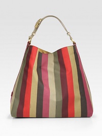 Roomy top-handle carryall crafted from vibrant canvas with rich leather trim.Adjustable top handle, 6-6½ dropTop snap closureOne inside zip pocketLinen/suede lining14¾W X 13H X 7DMade in ItalyPlease note: color and pattern may vary Roomy top-handle carryall crafted from vibrant canvas with rich leather trim.Adjustable top handle, 6-6½ dropTop snap closureOne inside zip pocketLinen/suede lining14¾W X 13H X 7DMade in ItalyPlease note: color and pattern may vary