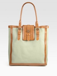 Luxe canvas pairs with supple leather in this elongated carryall, finished with sleek front buckles. Double adjustable leather top handles, 7¾-11 dropSliding tab on flap closureOne inside zip pocketTwo inside open pocketsCanvas lining13¾W X 14¾H X 3½DImported Luxe canvas pairs with supple leather in this elongated carryall, finished with sleek front buckles. Double adjustable leather top handles, 7¾-11 dropSliding tab on flap closureOne inside zip pocketTwo inside open pocketsCanvas lining13¾W X 14¾H X 3½DImported