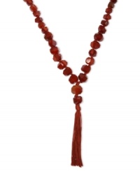 An on-trend tassel. Lucky Brand's strand necklace, crafted from silver tone mixed metal, is adorned with semi-precious carnelian accents to give it more body. Approximate length: 25 inches + 2-inch extender. Approximate drop: 5-1/2 inches. An on-trend tassel. Lucky Brand's strand necklace, crafted from silver tone mixed metal, is adorned with semi-precious carnelian accents to give it more body. Approximate length: 25 inches + 2-inch extender. Approximate drop: 5-1/2 inches.