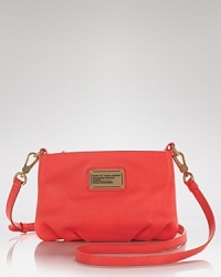 Skip the standard shades in favor of MARC BY MARC JACOBS' leather bag. In an ultra-femme hue and delicate shape, this crossbody hints at your girlie side. Skip the standard shades in favor of MARC BY MARC JACOBS' leather bag. In an ultra-femme hue and delicate shape, this crossbody hints at your girlie side.