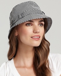 Set out on the town in style wearing a striped bucket rain hat with belted trim. Set out on the town in style wearing a striped bucket rain hat with belted trim.