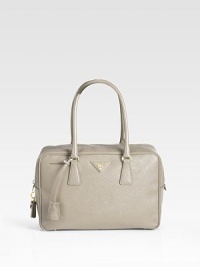 Calfskin leather finished with signature etching in a lady-like silhouette.Double top handles, 7 drop Top zip closure Protective metal feet One inside zip pocket Three inside open pockets Signature jacquard lining 12W X 8H X 4D Made in Italy Calfskin leather finished with signature etching in a lady-like silhouette.Double top handles, 7 drop Top zip closure Protective metal feet One inside zip pocket Three inside open pockets Signature jacquard lining 12W X 8H X 4D Made in Italy