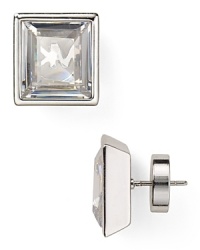 Glittering silver plate surrounds crystal stones on these sophisticated Michael Kors earrings, elegant by day and striking by night. Glittering silver plate surrounds crystal stones on these sophisticated Michael Kors earrings, elegant by day and striking by night.