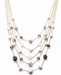 Try a fresh palette of color to brighten your look. This five-row illusion necklace by INC International Concepts combines plastic white beads, black glass beads, plastic fireballs, glass fireballs, white plastic beads, and frosted plastic beads. Set in gold tone mixed metal. Approximate length: 18 inches + 3-inch extender. Approximate drop: 3-1/2 inches. Try a fresh palette of color to brighten your look. This five-row illusion necklace by INC International Concepts combines plastic white beads, black glass beads, plastic fireballs, glass fireballs, white plastic beads, and frosted plastic beads. Set in gold tone mixed metal. Approximate length: 18 inches + 3-inch extender. Approximate drop: 3-1/2 inches.