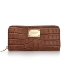 Get organized in the most exotic way with this chic, croc-embossed leather wallet from MICHAEL Michael Kors. Ideally sized to slip inside a handbag or carry as a clutch, it boasts plenty of pockets and compartments for cards, cash, coins, and more. Get organized in the most exotic way with this chic, croc-embossed leather wallet from MICHAEL Michael Kors. Ideally sized to slip inside a handbag or carry as a clutch, it boasts plenty of pockets and compartments for cards, cash, coins, and more.