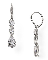 Designed to make an impression, these Nadri cubic zirconia earrings flaunt a triple drop design, set off in rhodium plated metal. Designed to make an impression, these Nadri cubic zirconia earrings flaunt a triple drop design, set off in rhodium plated metal.