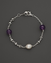 A bold sterling silver chain bracelet, gleaming with amethyst and freshwater pearl. By Di MODOLO. A bold sterling silver chain bracelet, gleaming with amethyst and freshwater pearl. By Di MODOLO.