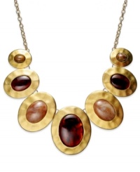 With antiqued appeal, this statement necklace from Style&co. flaunts hammered pendants with smoky resin accents. Crafted in matte gold tone mixed metal. Approximate length: 18 inches. Approximate drop: 5-1/2 inches. With antiqued appeal, this statement necklace from Style&co. flaunts hammered pendants with smoky resin accents. Crafted in matte gold tone mixed metal. Approximate length: 18 inches. Approximate drop: 5-1/2 inches.