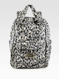 A lightweight nylon style in a fun abstract animal print with subtle logo topstitching.Double top handles, 5½ dropDouble adjustable shoulder straps, 8-12 dropTop zip closureTwo outside open pocketsOne outside zip pocketFully lined15W X 10¼H X 6½DImported A lightweight nylon style in a fun abstract animal print with subtle logo topstitching.Double top handles, 5½ dropDouble adjustable shoulder straps, 8-12 dropTop zip closureTwo outside open pocketsOne outside zip pocketFully lined15W X 10¼H X 6½DImported
