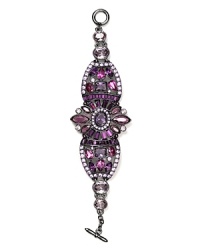 Exploring extreme shapes and using vibrant hues, Carolee Lux taps into this season's opulent mood with this glittering, stone bracelet. Exploring extreme shapes and using vibrant hues, Carolee Lux taps into this season's opulent mood with this glittering, stone bracelet.