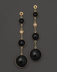 Sparkling diamonds highlight these drop earrings in bold black enamel and 18K yellow gold. Sparkling diamonds highlight these drop earrings in bold black enamel and 18K yellow gold.