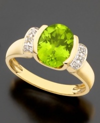 August's birthstone glows bright on this beautiful ring featuring oval-cut peridot (2-3/5 ct. t.w.) and round cut diamond accents set in 14k gold. August's birthstone glows bright on this beautiful ring featuring oval-cut peridot (2-3/5 ct. t.w.) and round cut diamond accents set in 14k gold.