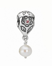 PANDORA's flower-engraved sterling silver charm features a punchy pink zirconia center and dangling white pearl accent. PANDORA's flower-engraved sterling silver charm features a punchy pink zirconia center and dangling white pearl accent.