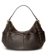 Get into a rocker-chic groove with this diva-worthy design from Vince Camuto, featuring rich leather, stud accents and golden hardware. It's roomy enough for the essentials and chic enough for whatever your day or night demands. Get into a rocker-chic groove with this diva-worthy design from Vince Camuto, featuring rich leather, stud accents and golden hardware. It's roomy enough for the essentials and chic enough for whatever your day or night demands.