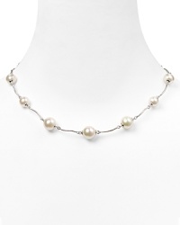 Luminous and versatile. Pearls are always a classic, and this curved link necklace from Majorica is a delicate way to wear them. Luminous and versatile. Pearls are always a classic, and this curved link necklace from Majorica is a delicate way to wear them.