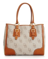 A signature style from Dooney & Bourke that will add an elegant touch to any outfit. A spacious design with classic detailing is a must-have for every girl's designer handbag collection. A signature style from Dooney & Bourke that will add an elegant touch to any outfit. A spacious design with classic detailing is a must-have for every girl's designer handbag collection.
