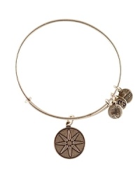 A starry symbol etched on a vintage-inspired charm hangs from this delicate Alex and Ani bangle, crafted from recycled materials. A starry symbol etched on a vintage-inspired charm hangs from this delicate Alex and Ani bangle, crafted from recycled materials.
