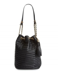 Keep your cool with a gorgeous quilted design from BCBGMAXAZRIA. This spacious bucket shape is accented with goldtone chains and a classic tassel charm. Keep your cool with a gorgeous quilted design from BCBGMAXAZRIA. This spacious bucket shape is accented with goldtone chains and a classic tassel charm.