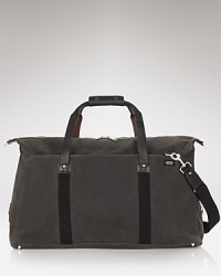 A handsome travel companion, this soft duffle makes toting your essentials a stylish affair. A handsome travel companion, this soft duffle makes toting your essentials a stylish affair.