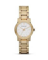 Freshen up your face with this gold-plated stainless steel watch from Burberry, accented by a check stamped dial. With Swiss movement and a slim profile, this understated style is a functional day-to-day choice. Freshen up your face with this gold-plated stainless steel watch from Burberry, accented by a check stamped dial. With Swiss movement and a slim profile, this understated style is a functional day-to-day choice.