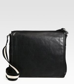 Simple, sleek design in calfskin leather is completed with a full flap closure and iconic trainspotting web shoulder strap detail.Flap closureAdjustable shoulder strapInterior pocketsFully lined15W x 13H x 4DMade in Switzerland