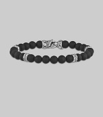 A strand of dramatic matte-finish black onyx beads, with a bold clasp and stations of hand-forged sterling silver.8mm matte onyx beads Sterling silver Length, about 9 Lobster clasp Made in USA