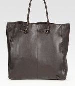 A handsome design in rich Italian leather with braided top handles.Double top handlesInterior zip pocketFully linedLeather17W x 17H x 7DMade in Italy