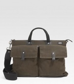 Rugged waxwear is soaked in a centuries-old paraffin formula that combines the durability of nylon and the ease of cotton and accentuates the marks of use. An interior divider adds convenience and organization. Zip closure Leather trim Front and back snap pockets Interior zip, organizing pockets Top handles, 12½ long Adjustable, detachable shoulder strap Fully lined 16½W X 13 X 4D Imported 