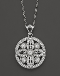 Faceted diamonds set in a gorgeous baroque 14K. white gold pendant. Faceted diamonds set in a gorgeous baroque 14K. white gold pendant.