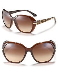 A gold hovering temple and mosaic printed arms ensure Prada's oversized round sunglasses look good from every angle. A gold hovering temple and mosaic printed arms ensure Prada's oversized round sunglasses look good from every angle.