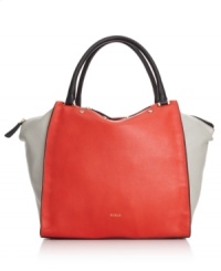 A new take on tradition, this chic leather shopper from Furla breaks all the rules. With an unexpected shape, cool colorblock design and sleek stud accents, it's certain to carry you from season to season. A new take on tradition, this chic leather shopper from Furla breaks all the rules. With an unexpected shape, cool colorblock design and sleek stud accents, it's certain to carry you from season to season.