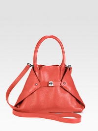 Rich pebble-grain leather crafted in a foldover trapezoid silhouette, cinched by a center turn-lock buckle closure.Double top handles, 4½ dropDetachable shoulder strap, 25 dropTop snap closure and versatile turn-lock buckle closure, can be tucked into bag for a tote silhouetteProtective metal feetOne inside zip pocketTwo inside open pocketsLinen lining13W X 7½H X 3DImported Rich pebble-grain leather crafted in a foldover trapezoid silhouette, cinched by a center turn-lock buckle closure.Double top handles, 4½ dropDetachable shoulder strap, 25 dropTop snap closure and versatile turn-lock buckle closure, can be tucked into bag for a tote silhouetteProtective metal feetOne inside zip pocketTwo inside open pocketsLinen lining13W X 7½H X 3DImported