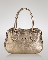 Cole Haan's shapely leather satchel is a versatile fall addition. Take a tailored approach--this ladylike style softens sleek suits, trousers and blazers. Cole Haan's shapely leather satchel is a versatile fall addition. Take a tailored approach--this ladylike style softens sleek suits, trousers and blazers.