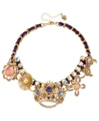 A crowning achievement. This frontal necklace from Betsey Johnson is crafted from gold-tone mixed metal and purple grosgrain ribbon, which provides the foundation for whimsical charms adorned with glass crystal accents. Approximate length: 15 inches + 3-inch extender. Approximate drop: 1-3/4 inches. A crowning achievement. This frontal necklace from Betsey Johnson is crafted from gold-tone mixed metal and purple grosgrain ribbon, which provides the foundation for whimsical charms adorned with glass crystal accents. Approximate length: 15 inches + 3-inch extender. Approximate drop: 1-3/4 inches.