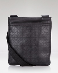 This sleek crossbody bag is adorned with Salvatore Ferragamo's signature Gancini logo allover. This sleek crossbody bag is adorned with Salvatore Ferragamo's signature Gancini logo allover.
