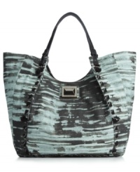 Keep things interesting with this ultra alluring canvas tote from Rachel Rachel Roy. Heavy stitching and oversized pyramid hardware make this this unique design truly one of a kind. Keep things interesting with this ultra alluring canvas tote from Rachel Rachel Roy. Heavy stitching and oversized pyramid hardware make this this unique design truly one of a kind.