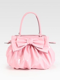 Lustrous patent leather in a roomy carryall, topped with a chic oversized bow.Double top handles, 7 dropTop zip closureOne inside zip pocketTwo inside open pocketsCotton lining14W X 13½H X 4DMade in Italy Lustrous patent leather in a roomy carryall, topped with a chic oversized bow.Double top handles, 7 dropTop zip closureOne inside zip pocketTwo inside open pocketsCotton lining14W X 13½H X 4DMade in Italy
