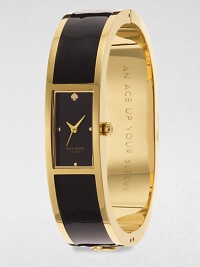 A chic enamel accented goldtone bangle timepiece. Quartz movementWater resistant to 3 ATMRectangular goldtone case, 16mm (0.6)Smooth bezelBlack dialDot hour markersSecond hand Enamel accented goldtone bangleImported A chic enamel accented goldtone bangle timepiece. Quartz movementWater resistant to 3 ATMRectangular goldtone case, 16mm (0.6)Smooth bezelBlack dialDot hour markersSecond hand Enamel accented goldtone bangleImported