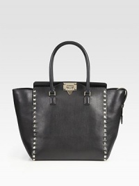 A refined silhouette in super-smooth Vitello leather, lined with polished metal studs for an edgy upgrade. Double top handles, 5½ dropTurn-lock closureProtective metal feetOne inside zip pocketTwo inside open pocketsCotton lining15½W X 11H X 4DMade in Italy A refined silhouette in super-smooth Vitello leather, lined with polished metal studs for an edgy upgrade. Double top handles, 5½ dropTurn-lock closureProtective metal feetOne inside zip pocketTwo inside open pocketsCotton lining15½W X 11H X 4DMade in Italy
