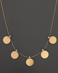 From the Chic & Shine collection, a gold coin necklace with diamonds. With signature ruby accent. Designed by Roberto Coin. From the Chic & Shine collection, a gold coin necklace with diamonds. With signature ruby accent. Designed by Roberto Coin.