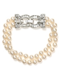 For the finishing touch to any elegant outfit, add this Carolee bracelet featuring two rows of pearls accented with a bold crystal detail. For the finishing touch to any elegant outfit, add this Carolee bracelet featuring two rows of pearls accented with a bold crystal detail.