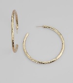Simple hoops become simply sensational when crafted with a rich hammered texture. 18k yellow gold Diameter, about 2 Post back Imported