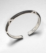 From the Soho Collection. Rich black spinel stones set in sleek sterling silver with dazzling white sapphire accents. Black spinelWhite sapphiresSterling silverLength, about 7.5Hinged closureImported 