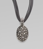 From the Starlight Collection. Granules of sparkling diamonds, resembling a starry night sky, are sprinkled on a black rhodium oval enhancer. Diamonds, 0.76 tcw Black rhodium and sterling silver Length, about 1½ Width, about ¾ ImportedPlease note: Chain sold separately. 