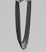 An edgy piece with a beautiful drape in 18k gold and blackened sterling silver box link chains. 18K goldBlackened sterling silverLength, about 18Toggle closureImported 