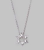 From the Tiny Treasures Collection. This petite diamond-encrusted star with an open center is set in 18k white gold and hangs from a sterling silver chain. Diamonds, 0.09 tcw 18k white gold and sterling silver Chain length, about 18 Pendant diameter, about ¼ Lobster clasp Made in Italy
