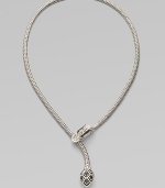 From the Naga Collection. A dramatic dragon head, set with faceted black sapphires, grips an intricate braided chain in his mouth while his shapely tail dangles below.Black sapphiresSterling silverLength, about 20Imported