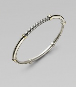 From the Metro Collection. A sleek, sophisticated bangle, combining smooth and cabled sterling silver with accents of 18k gold. Sterling silver and 18k yellow gold Diameter, about 2½ Imported